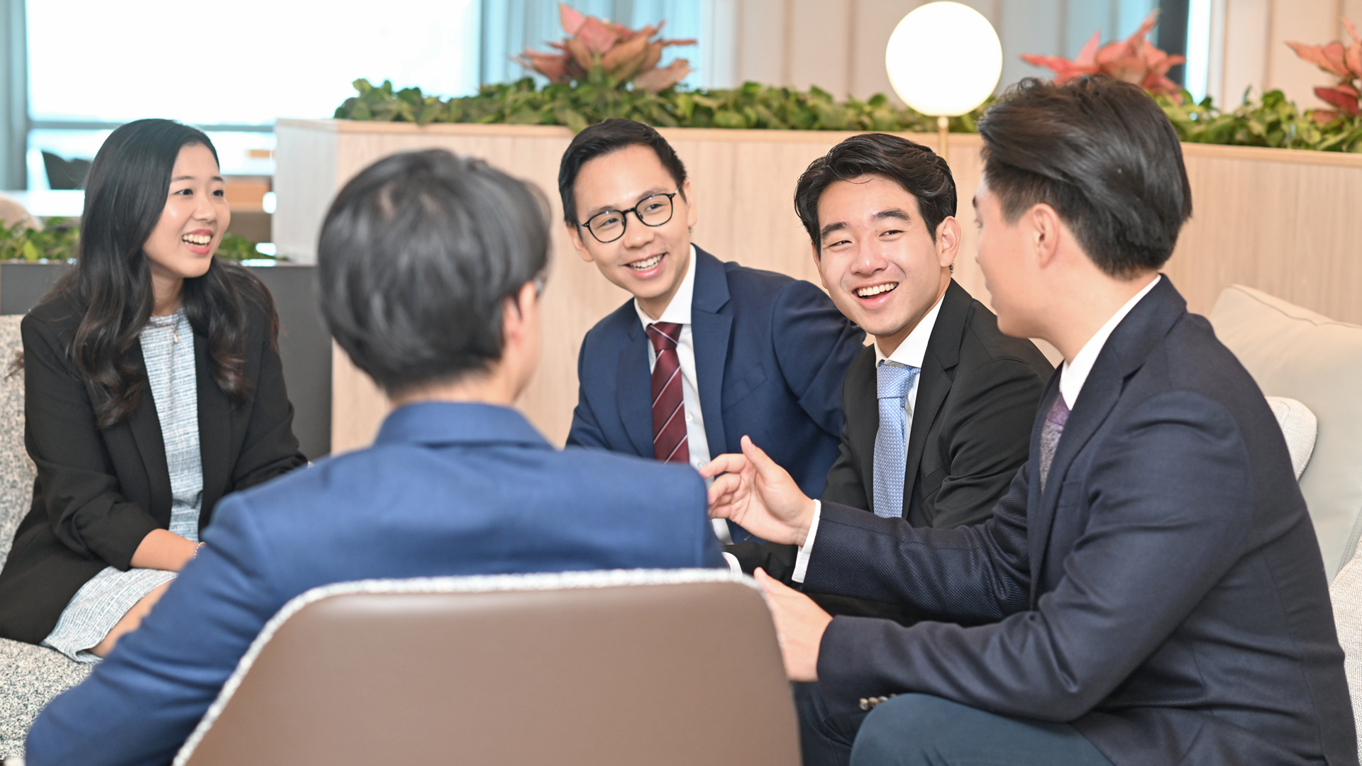 A team of young and diversified business executives in a meeting discussion